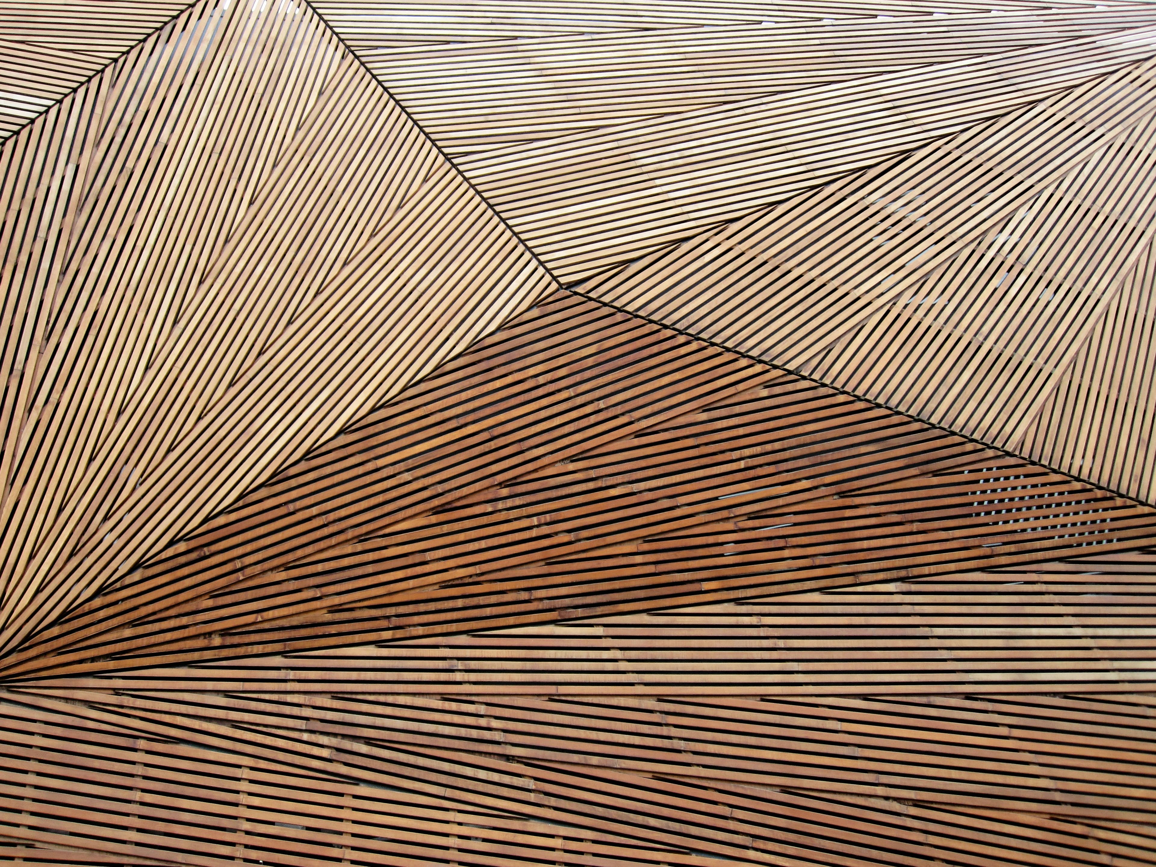 Geometric pattern made from intricately arranged wooden slats.